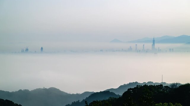 A breathtaking morning view of the Taipei city skyline emerging from a thick sea of clouds, captured from Datong Mountain in New Taipei City, Taiwan.