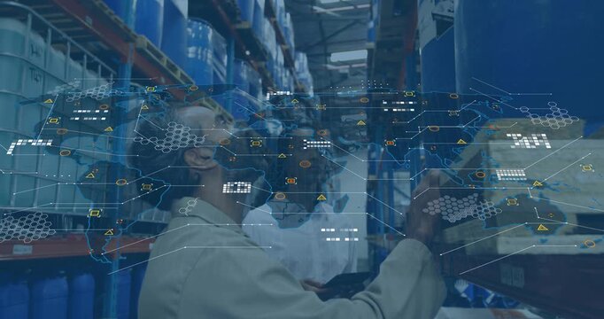 Vertical video: Walking aisle lead using tablet tech checking drums overlay mapping stock for audit