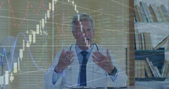 Vertical video: Doctor gesturing starting finance charts over hands showing down then up trends