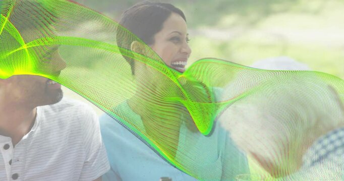Vertical video: Laughing woman in blue blouse turning to man entering, overlay passing bowl in park