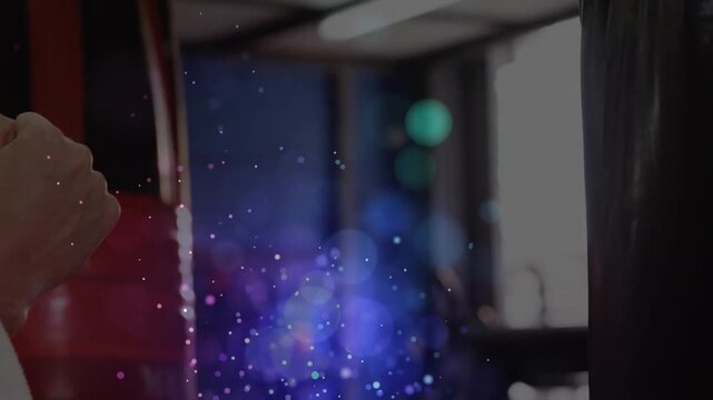 Trainee holding fists, right arm striking bag for fitness, switching guard hitting, bokeh drifting