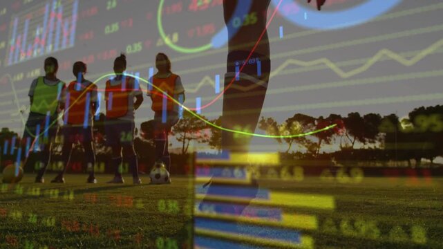 Woman kicker running to ball at sunset planting kicking while finance graphs overlaying team drill