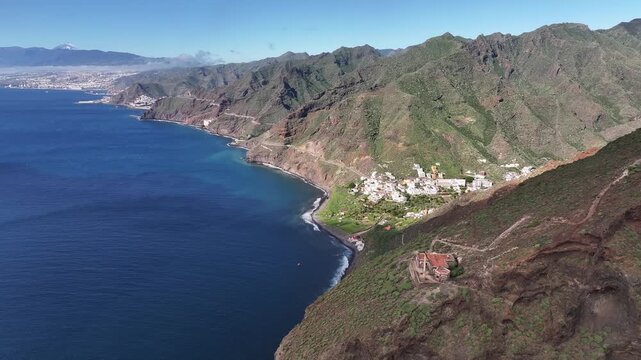 View of the village of Igueste in Tenerife, Canary Islands. In the foreground, an abandoned semaphore station. In the background, Las Teresitas beach, San Andres, and Santa Cruz.