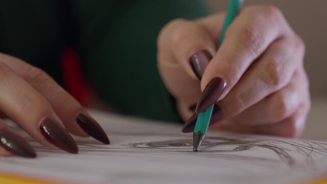 Steady Hand Crafting Confident Facial Lines. Consistent Hand Movement Shaping Detailed Facial Features. Controlled And Deliberate Hand Movements Produce Refined Facial Shapes In Artistic Sketching