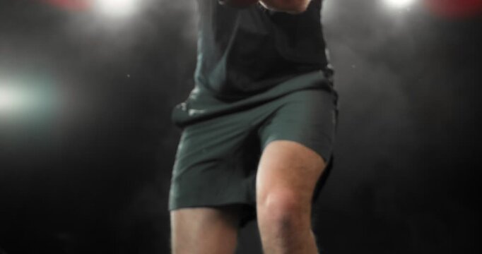Super slow motion close-up of a padel player hitting a ball with a racket, filmed at 1000 fps. Dramatic studio lighting highlights the impact, motion and energy of the sport in a dynamic action. Speed