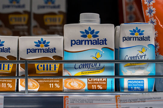 Parmalat brand milk and cream on the shelf in the dairy section of a grocery store. Minsk, Belarus - March 11, 2025