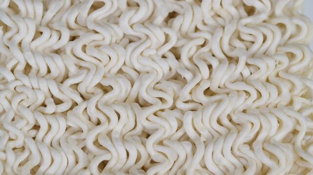 Study of noodle texture and packaging aesthetics in studio. Highresolution photograph showcasing intricate noodle formations and packaging for culinary visual references