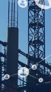 Vertical video: Showing column and crane, nodes appearing across site, worker in hat checking rebar