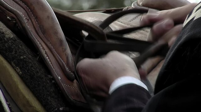 Gaucho Putting Saddle on Horse, Close Up of Hands Preparing Horse for Riding, Argentina - 4K