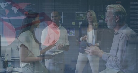 Presenting four business casual colleagues pointing at screens in meeting area, with tablets