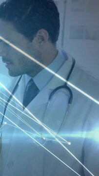 Vertical video: Medical doctor holding left, overlay sweeping grid over stethoscope causing gaze up