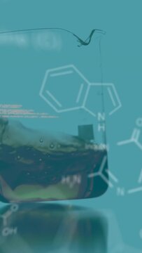 On code appearing, glass beaker showing wave climbing wall, marker rising, showing volume rise