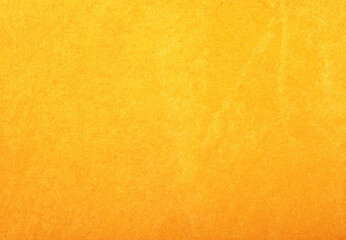 Obraz premium A vintage orange peel texture features a rough grunge pattern on an aged paper surface with yellow and brown antique tones for a textured material backdrop
