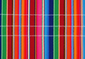 A colorful striped fabric with a vibrant plaid pattern