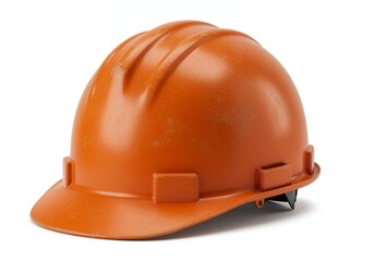 Fototapeta premium Orange hard hat with scratched surface and black chin strap