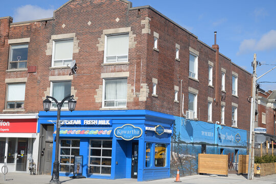 exterior building facade and sign of Kawartha Dairy, an ice cream shop, located at 888 Danforth Av, Toronto