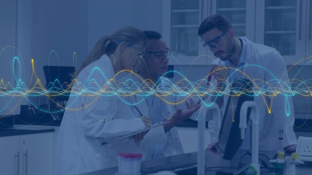 3 lab team at bench, center presenting sample starting inspection while waveform pulsing on monitor