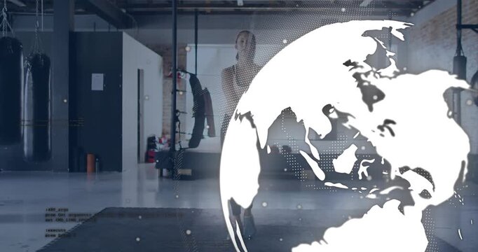 Female athlete starting two-foot jumping with jump rope on gym mat for cardio while globe sweeping