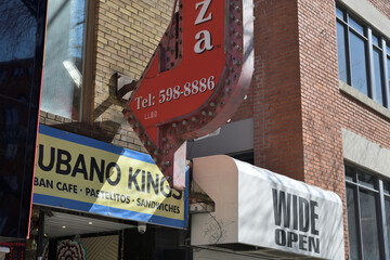 Obraz premium Spadina & Richmond Art & Eats, a cluster of local staples including Cubano Kings (141 Spadina), Wide Open bar (139A Spadina), and the vintage arrow-signed Mamma’s Pizza (405 Richmond), Toronto