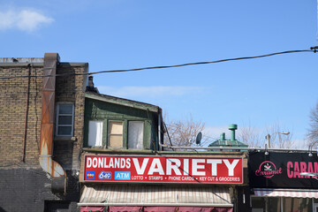 Obraz premium exterior building and sign outside Donlands Variety, a convenience store, located at 4 Donlands Av, Toronto