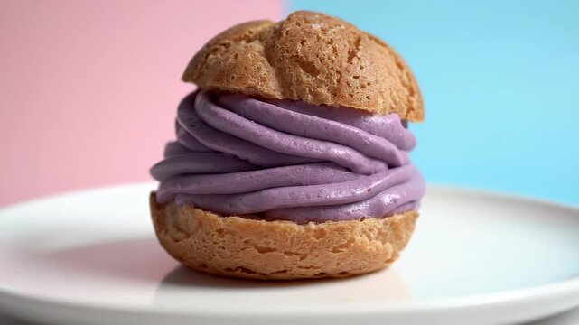 Cream Puff Filled With Purple Cream Served On White Plate Minimalist Studio Lighting Pastel Background Seamless Loop