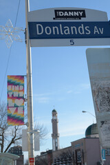 Obraz premium City of Toronto street sign at Donlands Av with BIA Banner 