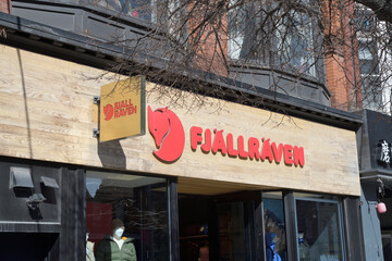 Obraz premium exterior building facade and sign of Fjällräven Brand Store, an outdoor clothing and equipment shop, 356 Queen St W, Toronto