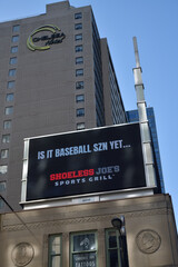Naklejka premium rooftop billboard ad for Shoeless Joe's Sports & Grill above heritage property at 380 Yonge St (and above Chelsea Hotel sign), Toronto