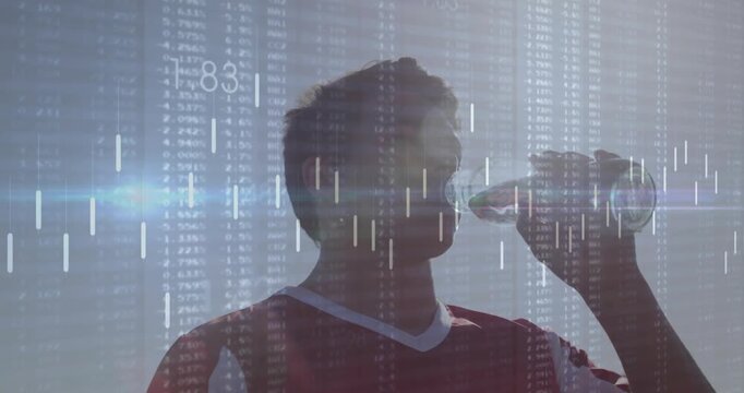 Drinking red-jersey teen from clear plastic bottle on field, reacting to sun with data overlay