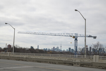 Naklejka premium construction crane (with EBC Inc sign) near Leaside Bridge, East York, Toronto