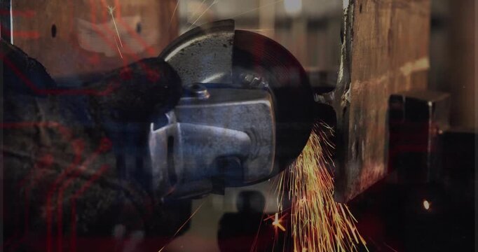 Gloved hand bringing grinder wheel close, producing sparks, grinding seam to smooth metal for weld