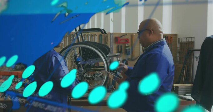Overlay appearing, two blue-jacket techs using tablet while fixing wheel axle on stand in shop