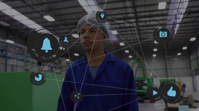 Factory worker tapping tablet starting overlay looking up walking checking machines linking systems