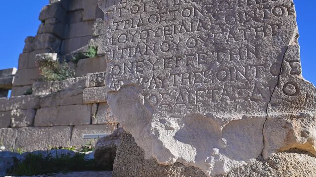 Ancient Greek text inscription on a theater ruin in Patara, Turkey