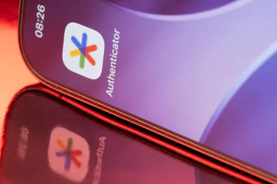 Google authenticator icon application on smartphone screen close up