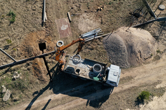 unloading concrete rings for the construction of wells and sewers top view