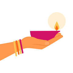 Obraz premium Diwali celebration: hand holding a Diya lamp