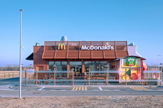 Mogilno, Poland - March 9, 2026. McDonald's drive-thru fast food restaurant on a colorful sunny morning.