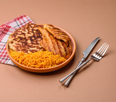 Dajaj Mashwi, an Arabic dish with rice and chicken, salt, and spices. Dajaj Mashwi as a background