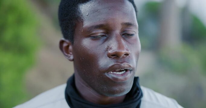 Face, fatigue and black man in woods, fitness for health benefits or rest for challenge. Nature, hiker or African person in forest, sweating or tired with exercise, exhausted or training for wellness