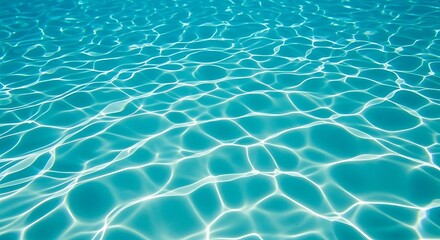 Obraz premium Turquoise water surface with sunlight reflections