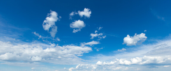 blue sky background with tiny clouds