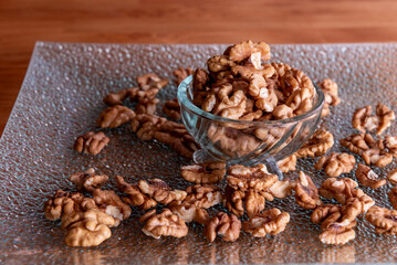 Obraz premium peeled walnut halves in a glass bowl