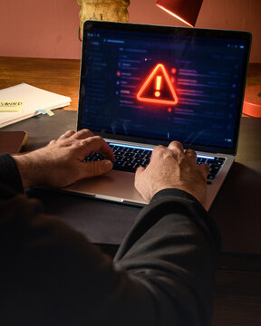 Red Warning Alert on Laptop Screen During Cyber Incident