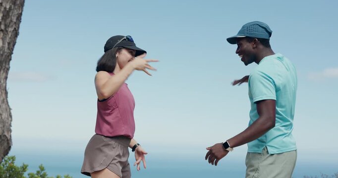 Laughing, couple and fist bump in nature, fitness and hug after exercise routine, happy and bonding. Outdoor, athlete and interracial people with smile for wellness, embrace and secret handshake