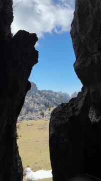the texture of the opposite mountains through a vertical cave