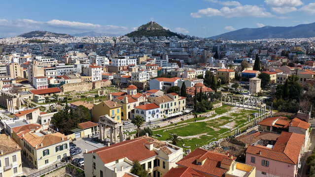 Aerial drone portrait photo of ancient Roman Market featuring tower of Winds and Gate of Athena in the heart of Athens historic centre built in Plaka district, below Acropolis hill, Attica, Greece