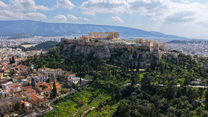 Obraz premium Aerial drone photo above Acropolis hill and the Parthenon featuring Propylaea and porch of the Caryatids, Athens historic centre, Attica, Greece