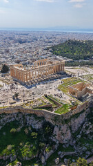 Naklejka premium Aerial drone photo above Acropolis hill and the Parthenon featuring Propylaea and porch of the Caryatids, Athens historic centre, Attica, Greece