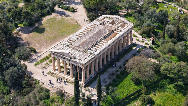 Aerial drone photo of iconic Temple of Hephaestus in Ancient Agora of Athens historic centre built below Acropolis hill , Attica, Greece
